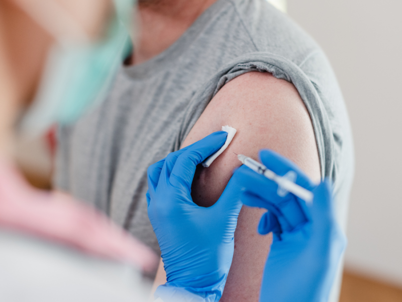 An image of a nurse administering a shot
