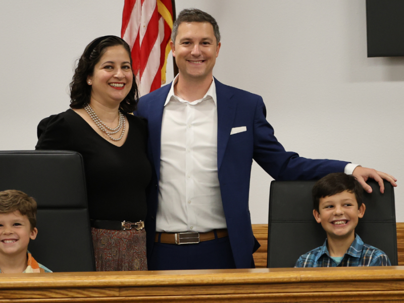 A man, woman and two children pose for a photo.