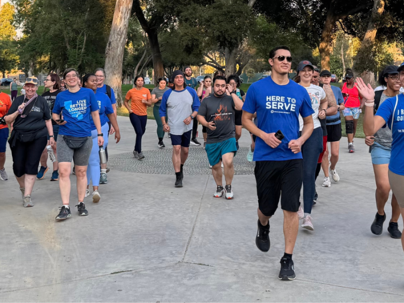A group of runners in blue shirts.