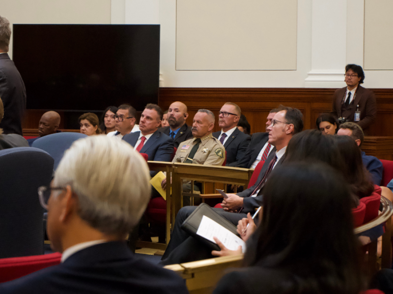 A photo of people in a courtroom