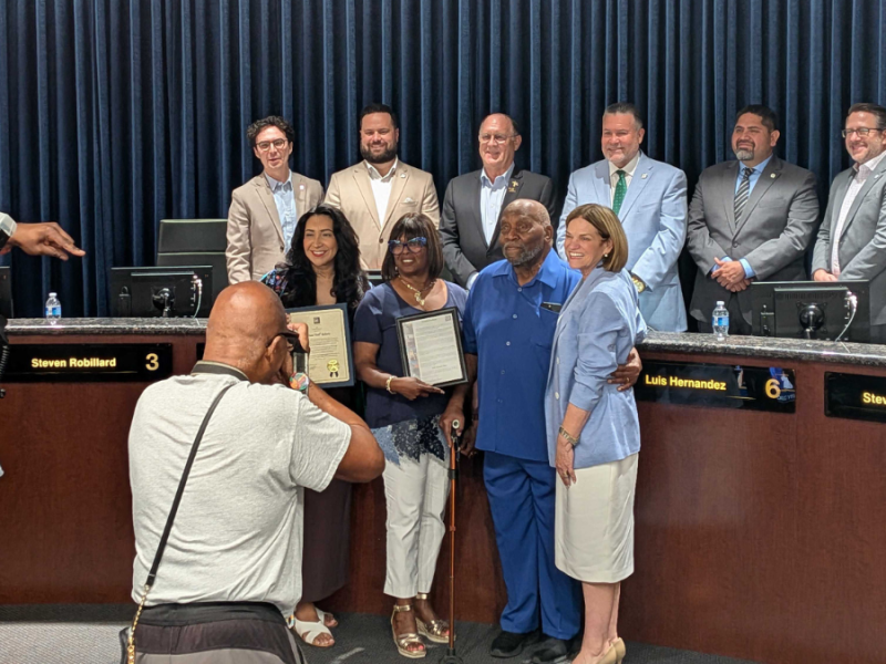 Dell Roberts poses for a photo with the Riverside City Council