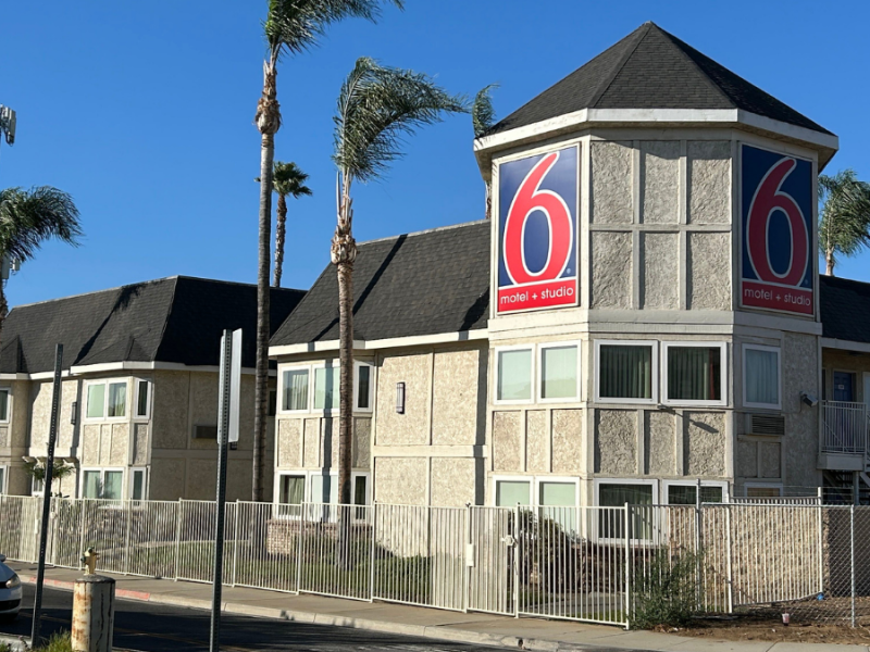 An exterior photograph of a Motel 6 in Riverside.