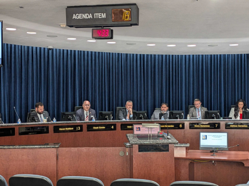 The council deliberates at the dais.