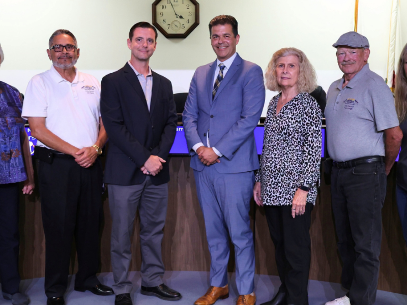 A posed photo of the new city manager, interim city manager and Hemet City Council.